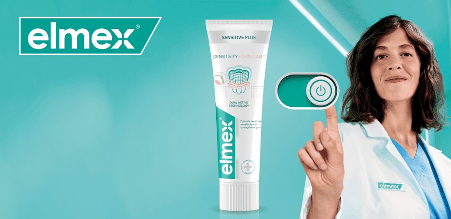 Promocijska pasica znamke elmex, ki prikazuje strokovnjakinjo v beli halji ob simbolu za vklop, na značilnem turkiznem ozadju.